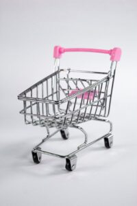 shopping cart with a pink handle
